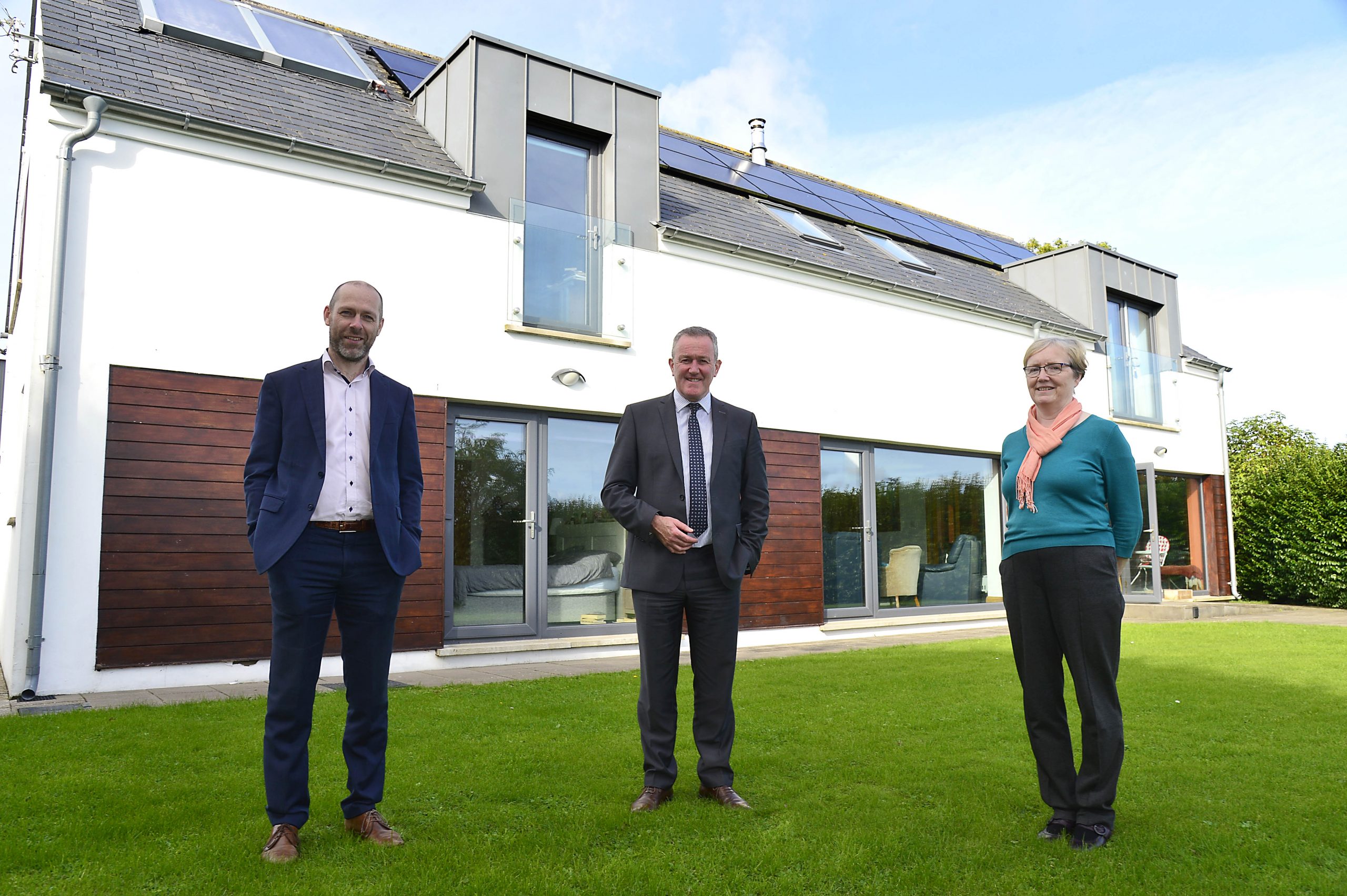 Director of Royal Society of Architects Ciaran Fox, Finance Minister Conor Murphy and homeowner Helen McGlinchey at the launch of the Department of Finance’s energy efficiency consultation.
